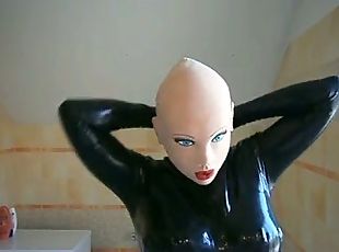 Masked latex doll with blond wig